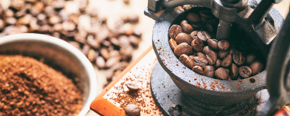 Coffee beans and a coffee grinder