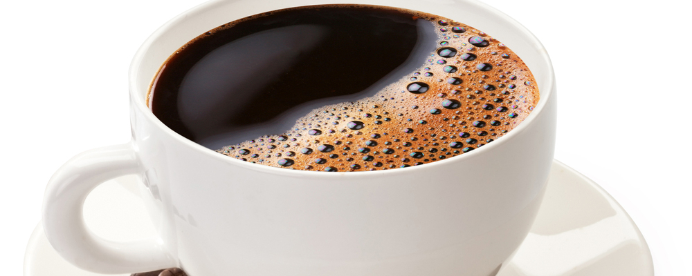 Coffee cup and beans on a white background. File contains the path to cut.