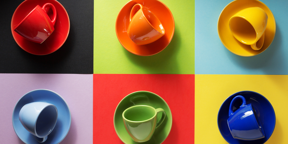 empty cup and saucer at colorful paper