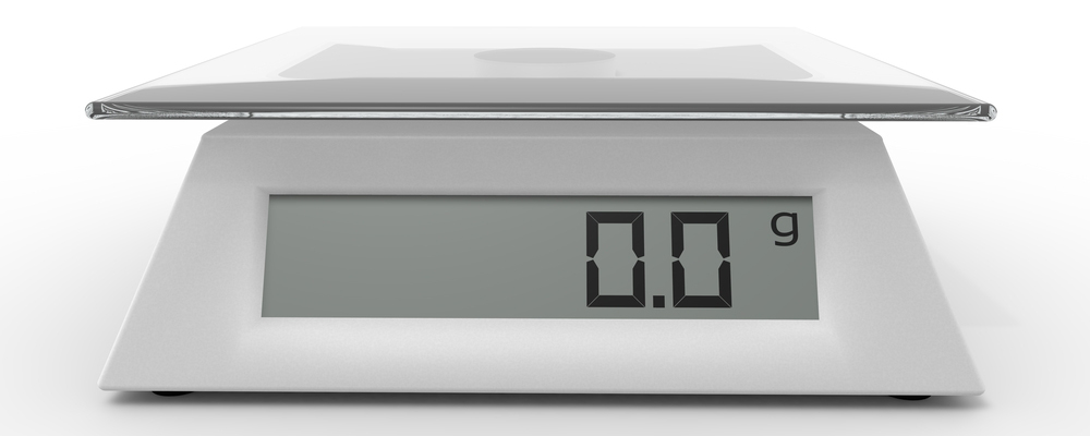 Included electronic kitchen scales on the isolated background