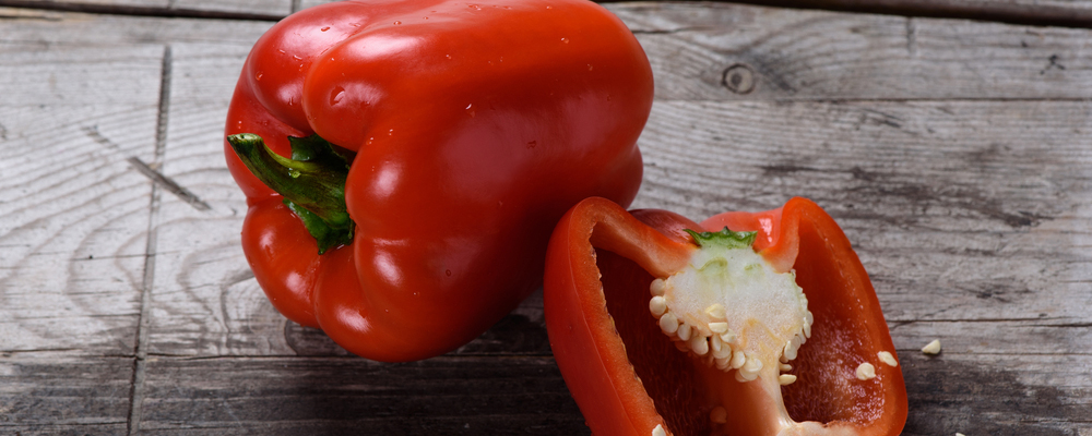 Red Bell pepper on wooden table