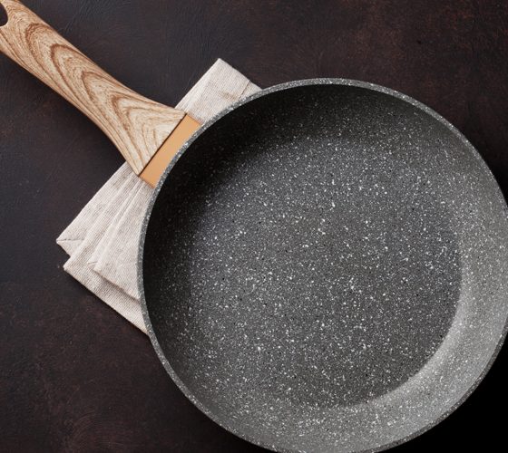 Frying pan over stone table
