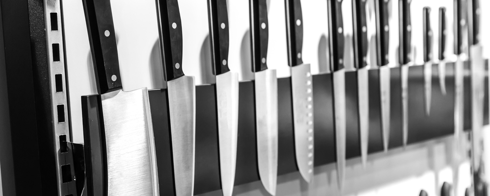 Kitchen knives on magnetic holder closeup