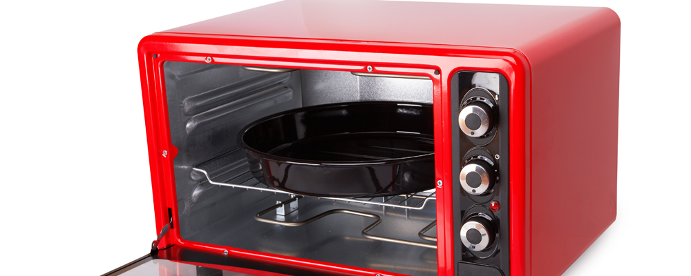 Kitchen red oven isolated on a white background
