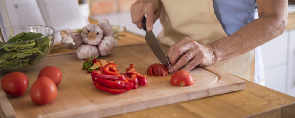 Vegetables being cutted on the cutting board