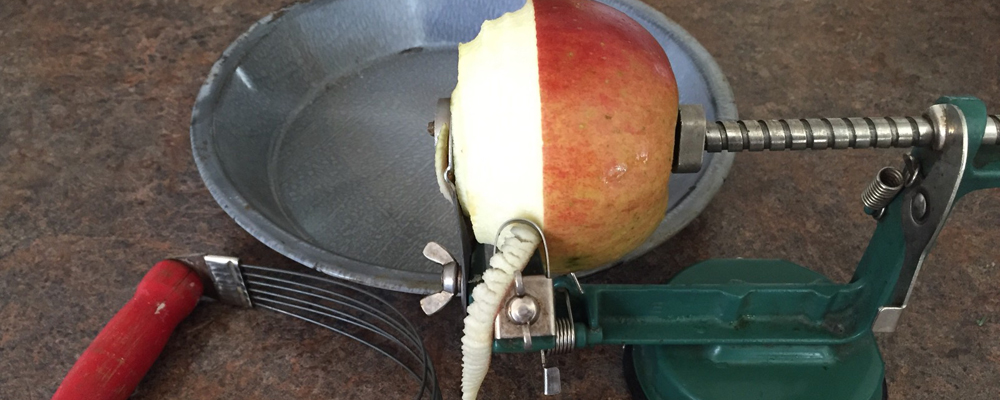 Peeling apple with apple peeler