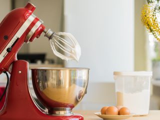 Red stand mixer mixing cream