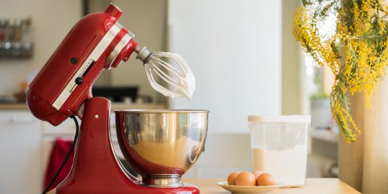Red stand mixer mixing cream